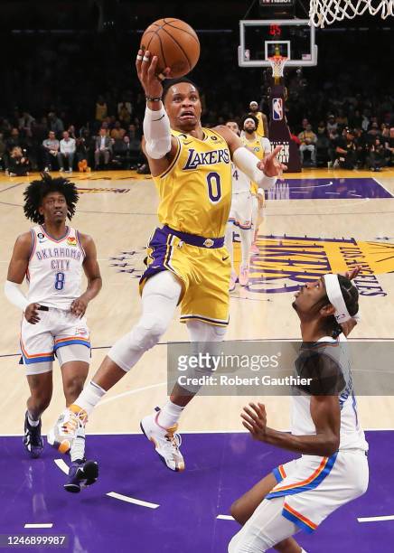 Los Angeles, CA, Tuesday, February7, 2023 - Los Angeles Lakers guard Russell Westbrook drives to the basket over Oklahoma City Thunder guard Shai...