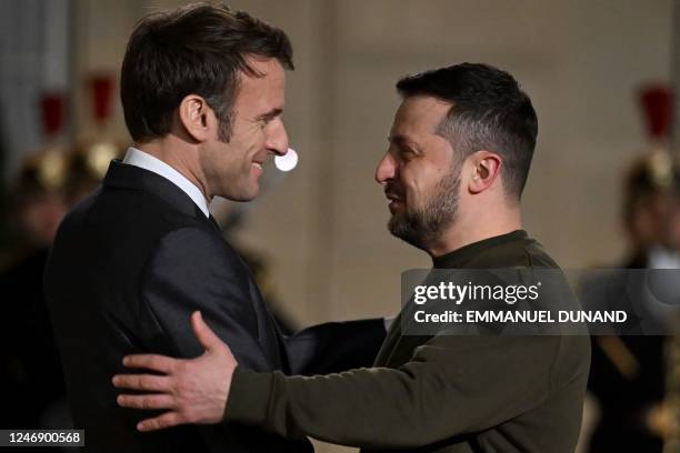 France's President Emmanuel Macron welcomes Ukraine's President Volodymyr Zelensky upon his arrival at the Elysee presidential palace for a meeting...