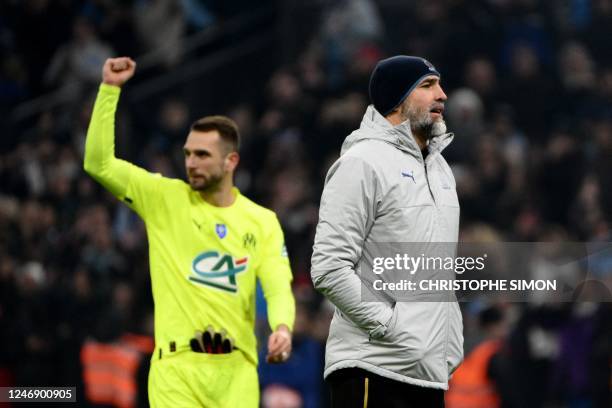 Marseille's Spanish goalkeeper Pau Lopez and Marseille's Croatian head coach Igor Tudor react after winning the French Cup round of 16 football match...