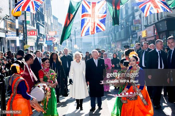 King Charles III and Camilla, Queen Consort meet members of the public during a visit to the Bangladeshi community of Brick Lane on February 8, 2023...