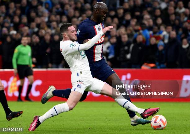 Marseille's French midfielder Jordan Veretout fights for the ball with Paris Saint-Germain's Portuguese midfielder Danilo Pereira during the French...