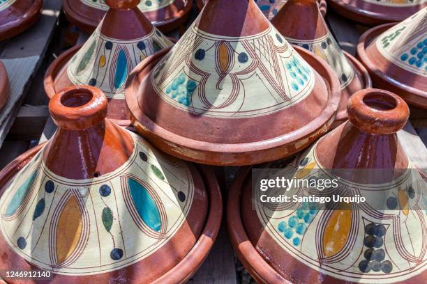 tagine terracottas for sale at market stall - tajine stock pictures, royalty-free photos & images