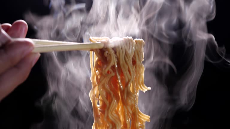https://media.gettyimages.com/id/1246914476/video/chopsticks-to-tasty-noodles-with-steam-and-smoke-in-4k-resolution-on-dark-background-asian.jpg?b=1&s=640x640&k=20&c=vMgDbBlSZ6zKrFFnJz0SUe3nhhP0kMmhJTU5T1i-Lys=