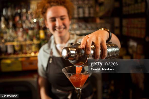 female bartender mixing drinks at the bar - food processor stock pictures, royalty-free photos & images