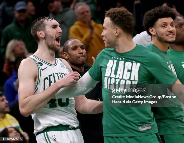 February 8: Blake Griffin of the Boston Celtics holds back Luke Kornet in a joking way at the end of the fourth quarter during the NBA game against...