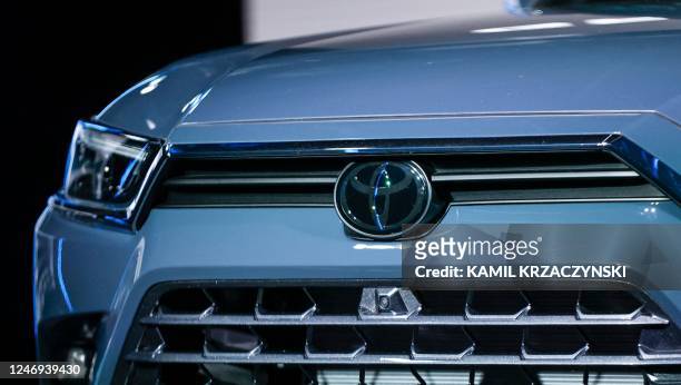 The Toyota logo is seen on the front of the all-new, three-row 2024 Toyota Grand Highlander as it is introduced during world premiere event at...