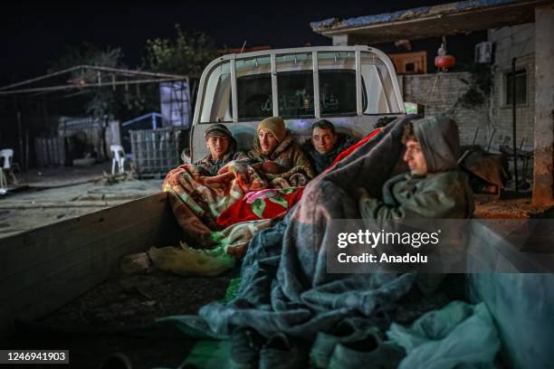 People spend night in vehicles after their houses damaged or collapsed in devastating 7.7 and 7.6 magnitude Kahramanmaras earthquakes in Afrin...