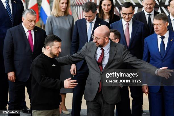 Ukraine's president Volodymyr Zelensky is welcomed by President of the European Council Charles Michel as EU leaders gather for a family picture...