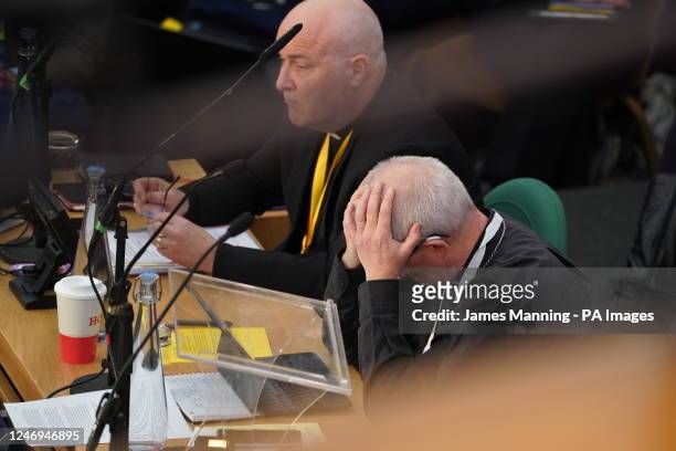 The Archbishop of Canterbury, Justin Welby holds his head in his hands, during a Synod at the General Synod of the Church of England, at Church House...