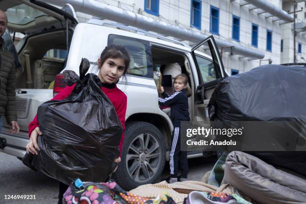 Volunteers collect packages to be sent for the victims of the devastating earthquakes in Turkiye as part of campaigns initiated by non-governmental...