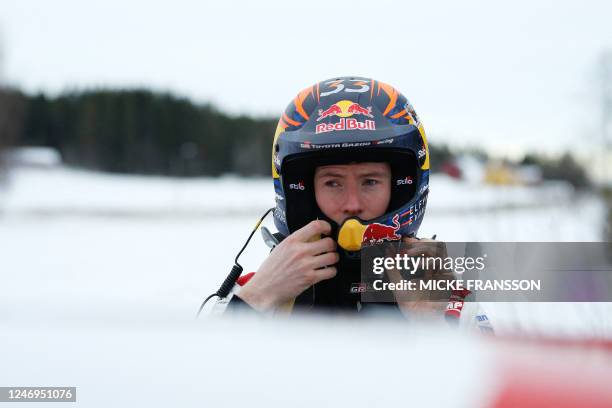 Elfyn Evans of Great Britain stands with am elmet by his Toyota GR Yaris Rally 1 HYBRID during the shakedown of the Rally Sweden, second round of the...