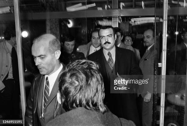 French Hubert Massol is arrested by policemen after a press conference at Paris on February 21, 1973. The coffin of Philippe Pétain was taken out at...
