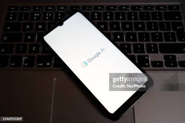 In this photo illustration a Google AI logo seen displayed on a smartphone screen with a computer keyword in the background in Athens, Greece on...