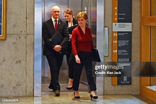 First Minister Nicola Sturgeon on the way to First Minister's Questions in the Scottish Parliament, accompanied by her deputy John Swinney, on...