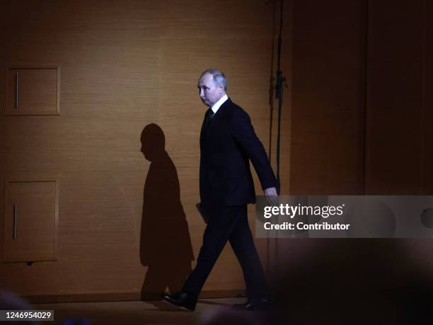 Russian President Vladimir Putin enters the hall during an event marking the 100th anniversary of domestic civil aviation at the State Kremlin...