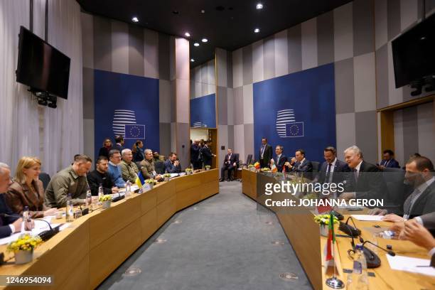 Ukrainian President Volodymyr Zelensky attends a bilateral meeting with EU leaders during the European leaders summit in Brussels on February 9,...