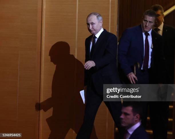 Russian President Vladimir Putin enters the hall during an event marking the 100th anniversary of domestic civil aviation at the State Kremlin...