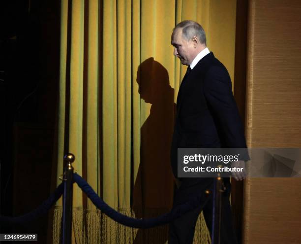 Russian President Vladimir Putin enters the hall during an event marking the 100th anniversary of domestic civil aviation at the State Kremlin...