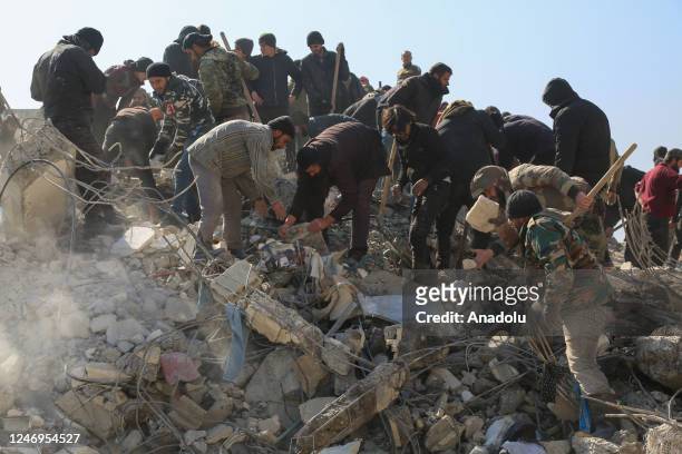Personnel and civilians conduct search and rescue operations in Afrin district of Aleppo, Syria after 7.7 and 7.6 magnitude earthquakes hits...