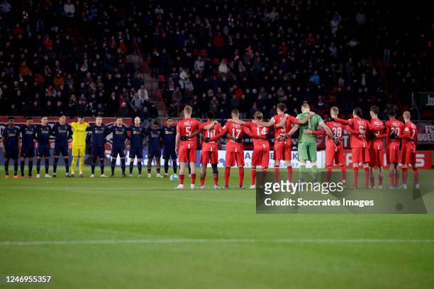 Players of FC Twente and Ajax stand during a minute of silence for the victims of earthquake in Turkey and Syria during the Dutch Eredivisie match...