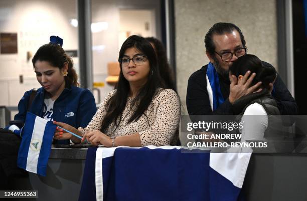 Activists and supporters wait for the arrival of political prisoners from Nicaragua at Dulles International Airport in Dulles, Virginia, on February...