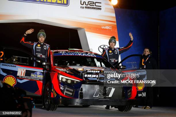 Craig Breen of Ireland and James Fulton of Ireland stand by their Hyundai i20 N Rally1 Hybrid during the 1st stage of the Rally Sweden, second round...