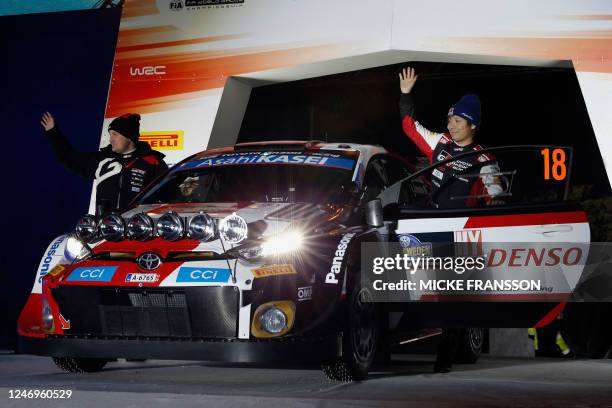 Takamoto Katsuta of Japan and his co-driver Aaron Johnston of Ireland stand by their Toyota GR Yaris Rally 1 HYBRID during the 1st stage of the Rally...