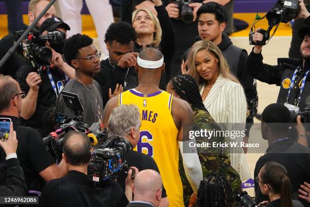 Los Angeles Lakers LeBron James celebrates with his mother Gloria James, wife Savannah James and sons Bryce Maximus and Bronny James after breaking...