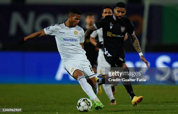Pipe Gomez of CD Nacional with Derick Poloni of Casa Pia AC in action during the Portuguese Cup match between Casa Pia AC and CD Nacional at Estadio...