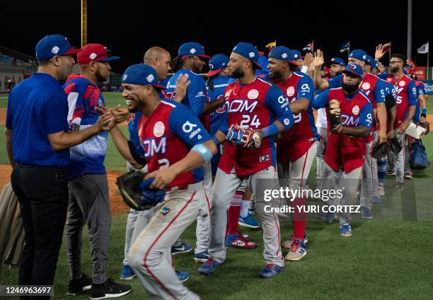 Dominican Republic's Tigres de Licey players celebrate qualifying to the final after defeating Mexico's Caneros de Los Mochis in their Caribbean...