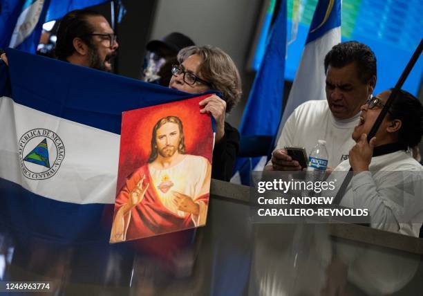 Activists and supporters wait for the arrival of political prisoners from Nicaragua at Dulles International Airport in Dulles, Virginia, on February...