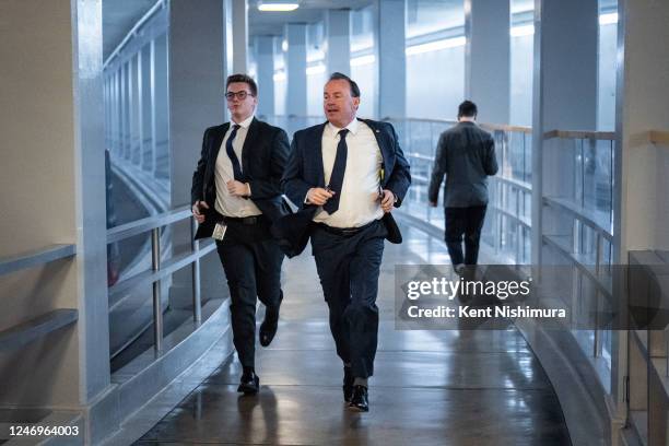 Sen. Mike Lee runs with a staffer in the Senate Subway of the U.S. Capitol on Thursday, Feb. 9, 2023 in Washington, DC.