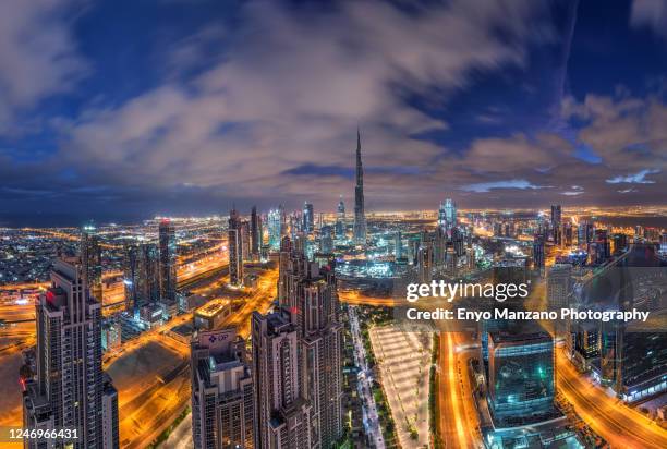 aerial view of business bay dubai - burj khalifa clouds stock pictures, royalty-free photos & images