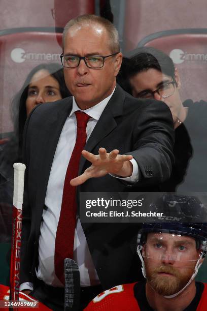 Florida Panthers Head Coach Paul Maurice monitors game progress from the bench against the San Jose Sharks at the FLA Live Arena on February 9, 2023...