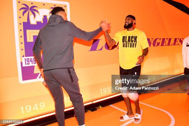 LeBron James of the Los Angeles Lakers greets Giannis Antetokounmpo of the Milwaukee Bucks before the game on February 9, 2023 at Crypto.Com Arena in...