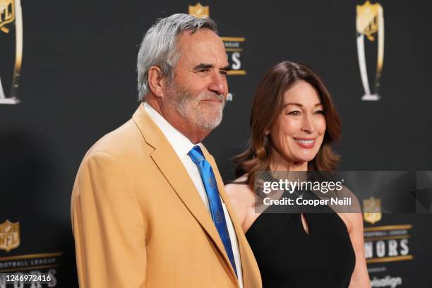 Dan Fouts and Jeri Martin pose for a photo on the red carpet during NFL Honors at the Symphony Hall on February 9, 2023 in Phoenix, Arizona.