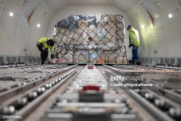 February 2023, Hesse, Frankfurt/Main: Workers load in-kind donations collected by private donors such as Alevi communities and sports clubs in Hesse...