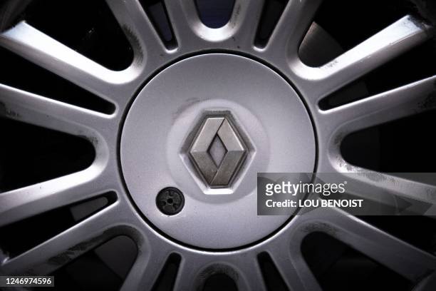 This photograph taken on January 26 shows the Renault logo on the hubcap of a Renault Twingo car, at the Lormauto company, in Hermival-les-vaux, near...