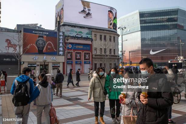 Pedestrians in the Wangfujing shopping area in Beijing, China, on Friday, Feb. 10, 2023. China's consumer inflation accelerated last month as the...