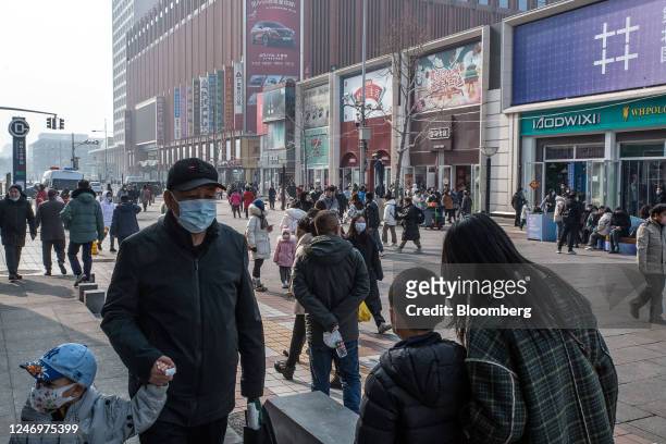 Pedestrians in the Wangfujing shopping area in Beijing, China, on Friday, Feb. 10, 2023. China's consumer inflation accelerated last month as the...