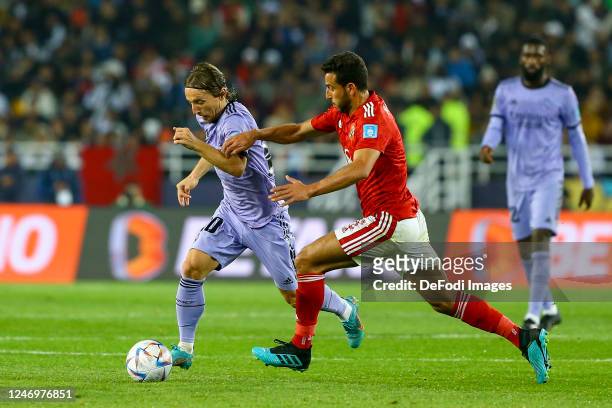 Luka Modric of Real Madrid and Hamdy Fathy of Al Ahly battle for the ball during the FIFA Club World Cup Morocco 2022 Semi Final match between Al...