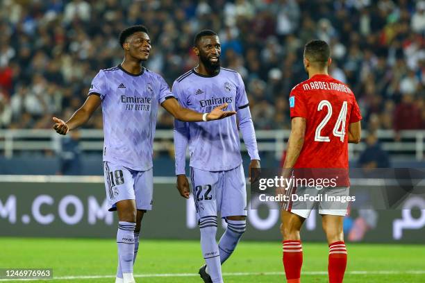 Aurelien Tchouameni of Real Madrid, Antonio Ruediger of Real Madrid and Mohamed Abdelmonem of Al Ahly discuss after a foul during the FIFA Club World...