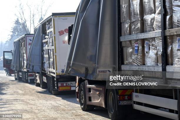 Trucks, containing humanitarian aid collected by Croatian government, Caritas and the Croatian Red Cross, line-up at the logistics center of the...