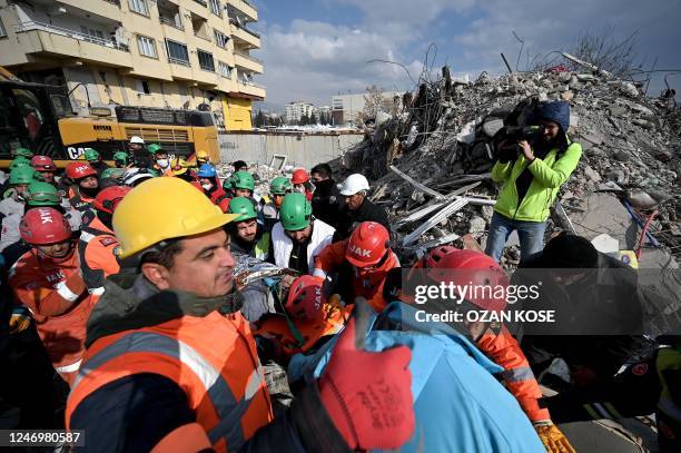 Rescuers lead a rescue operation to save 25-year-old Ayse from the rubble of a collapsed building in Kahramanmaras, on February 10 five days after a...