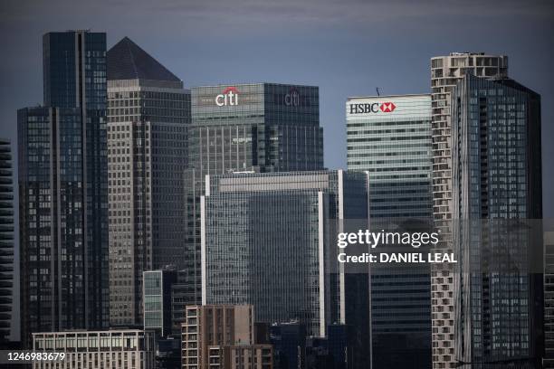 Picture taken on February 10, 2023 shows the Citibank and the HSBC bank building, in Canary Wharf financial district, south east London. - Britain's...