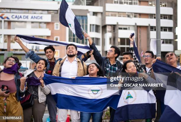 Nicaraguans living in exile in Costa Rica celebrate in San Jose, on February 9 after Nicaragua freed over 200 detained opposition members and...