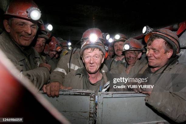 Russian miners stand in an elevator waiting to descend into the Chertinsky Yuzhny coal mine 120km from the Siberian city of Kemerovo in the town...