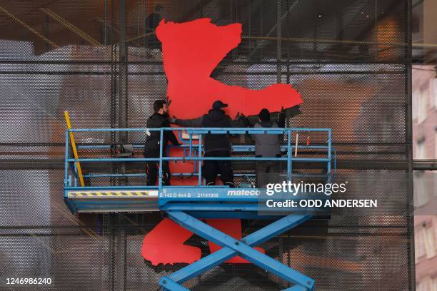 Banner depicting the Berlinale bear is being installed on the Berlinale Palast facade, six days ahead of the film festival opening, in Berlin,...