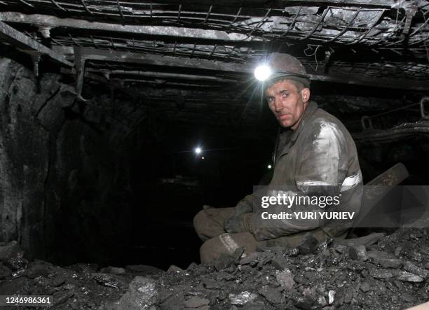 Russian miner takes a break from his work inside the Chertinsky Yuzhny coal mine 120km from the Siberian city of Kemerovo in the town Belovo on April...