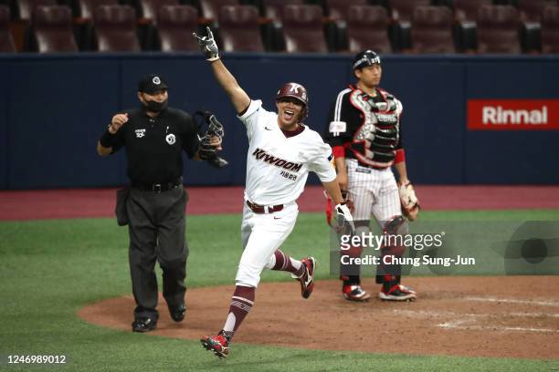 Outfielder Huh Jung-Heop of Kiwoom Heroes runs into home plate to make a scores 5:4 after Infielder Jeon Byeong-Woo hits game-ending double in the...